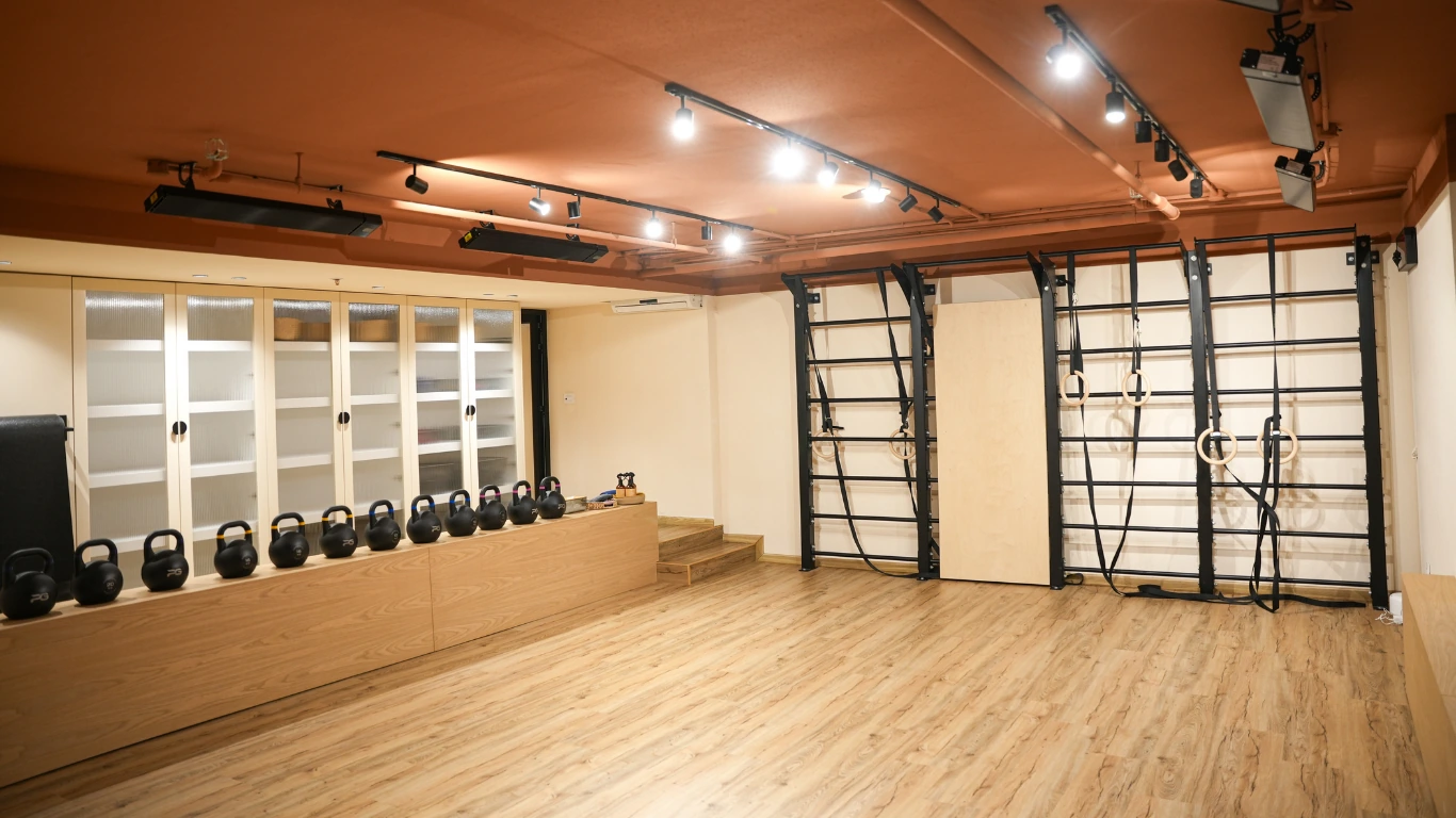 Movement studio with kettlebells and wall bars